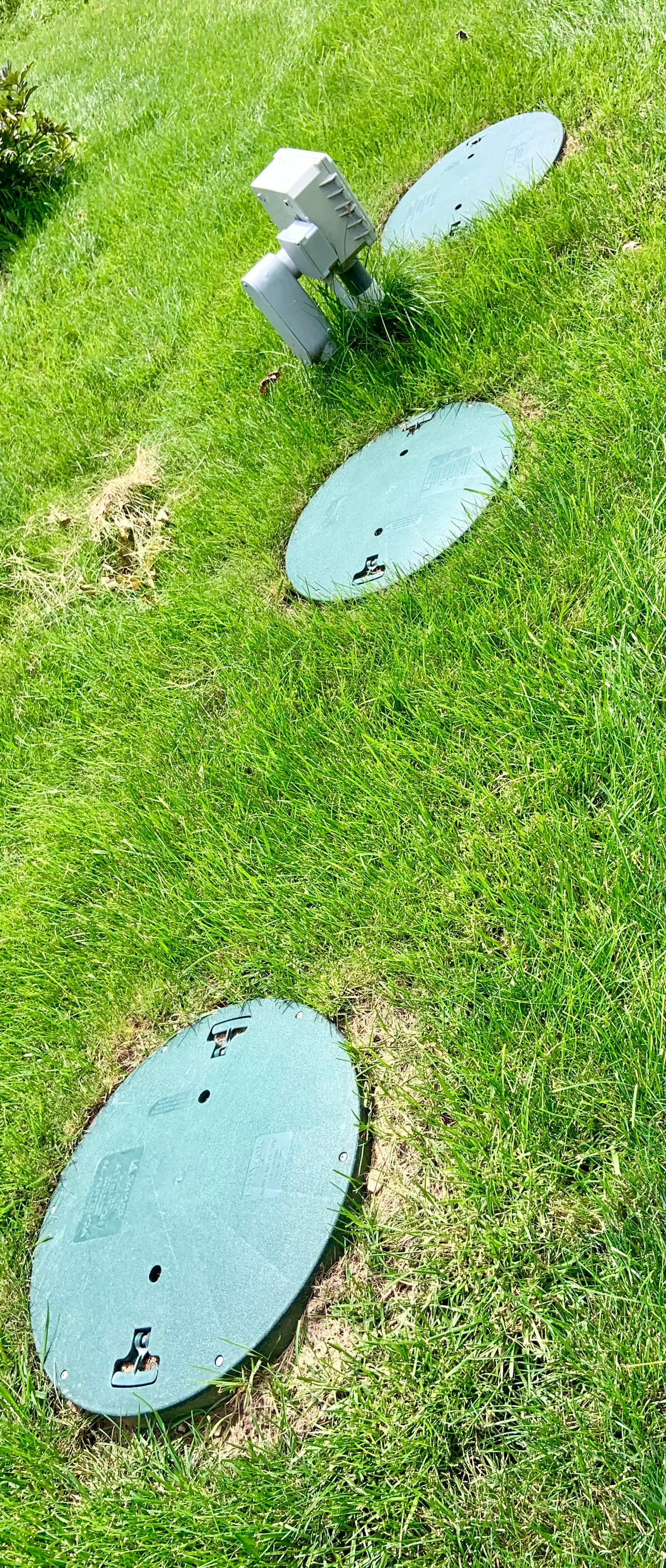 Technician performing a routine aerobic septic maintenance inspection in Comal County, Texas