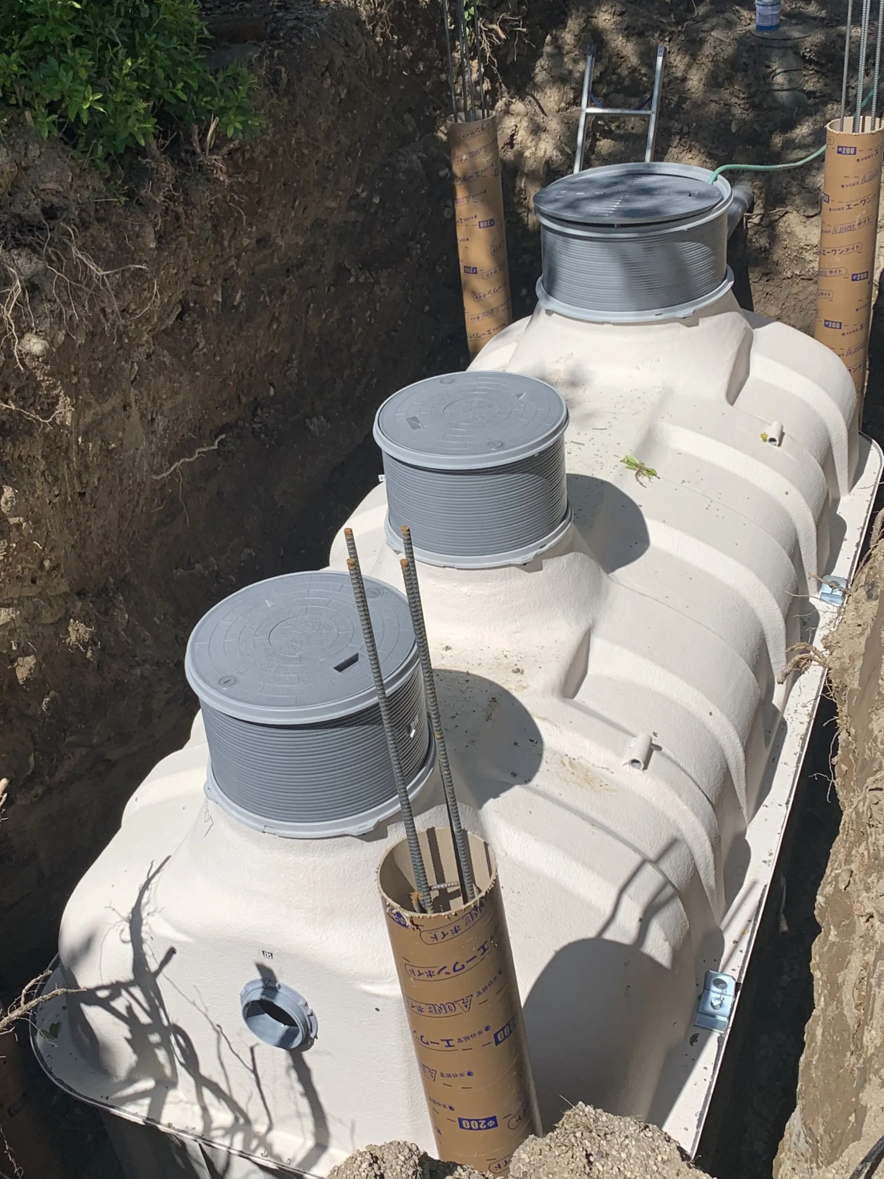 Aerobic septic system components being repaired at a home in Comal County, Texas